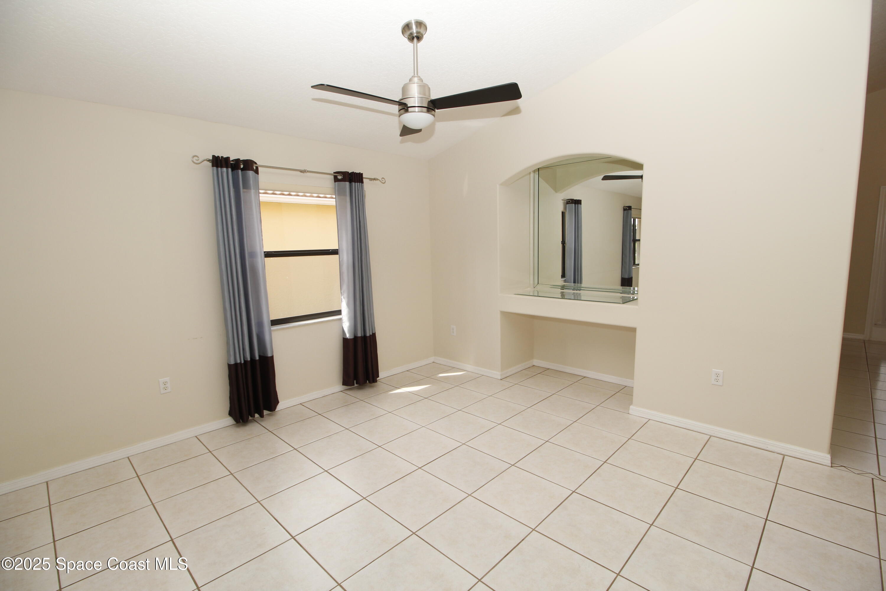 7971 Daventry Drive Melbourne, FL 32940 - Photo 9 of 22 an empty room with closet