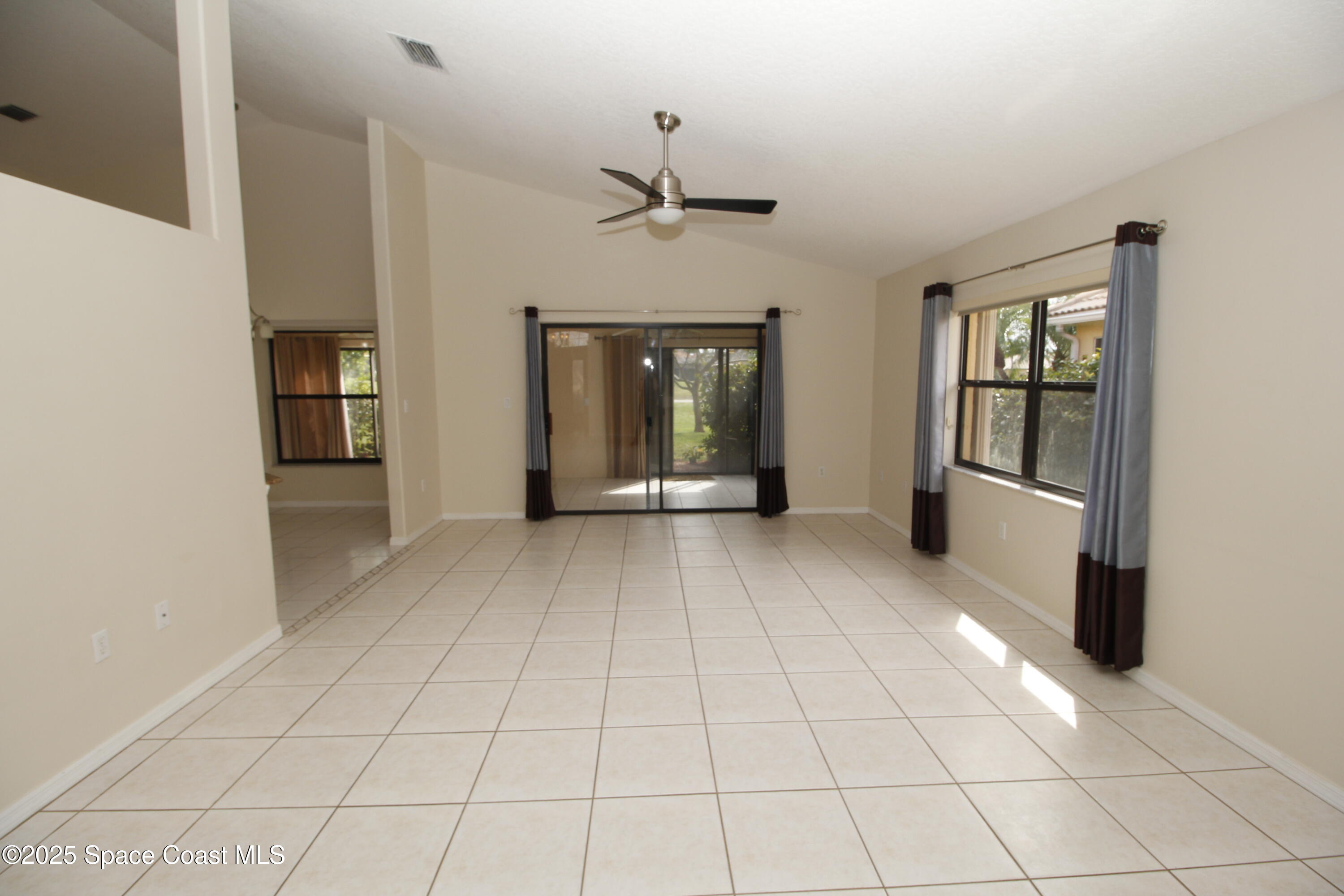 7971 Daventry Drive Melbourne, FL 32940 - Photo 10 of 22 a view of an empty room with a window