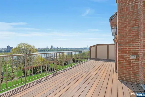 a balcony with view of balcony and wooden floor
