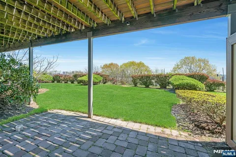 a view of an apartment with a backyard