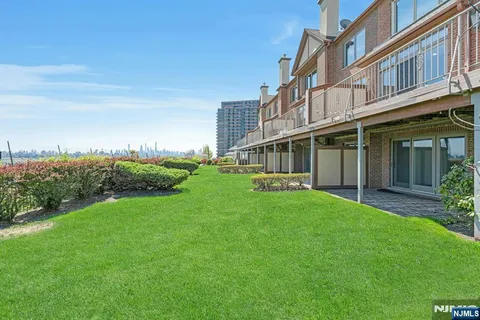 a view of a building with a yard