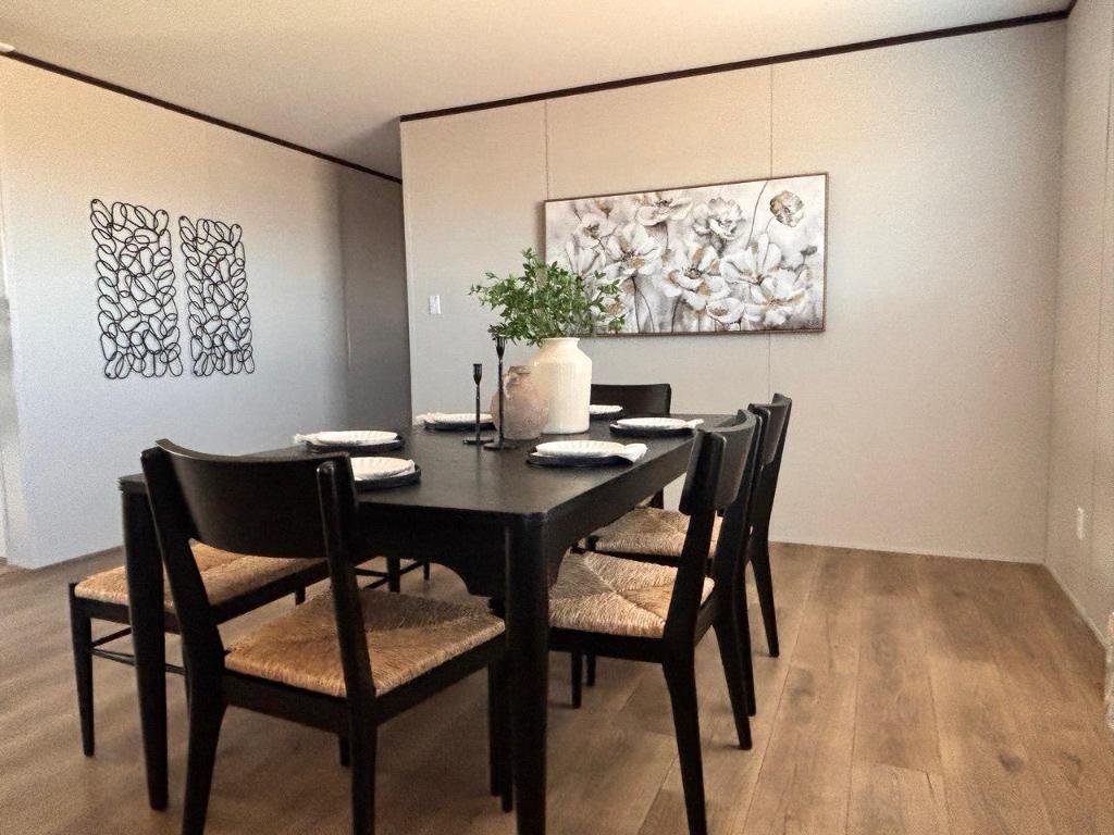 149 Castellana Way Elgin, TX 78621 - Photo 2 of 18 a view of a dining room with furniture