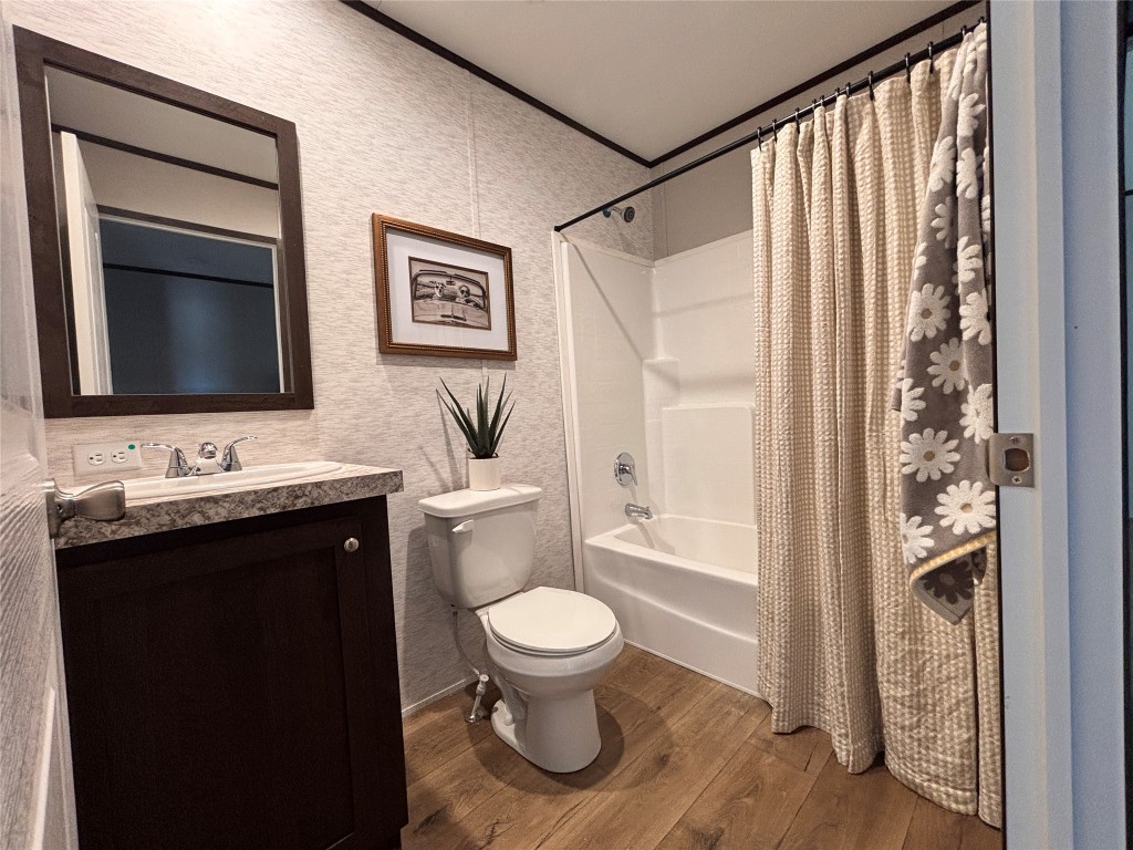 149 Castellana Way Elgin, TX 78621 - Photo 8 of 18 a bathroom with a granite countertop sink toilet and shower
