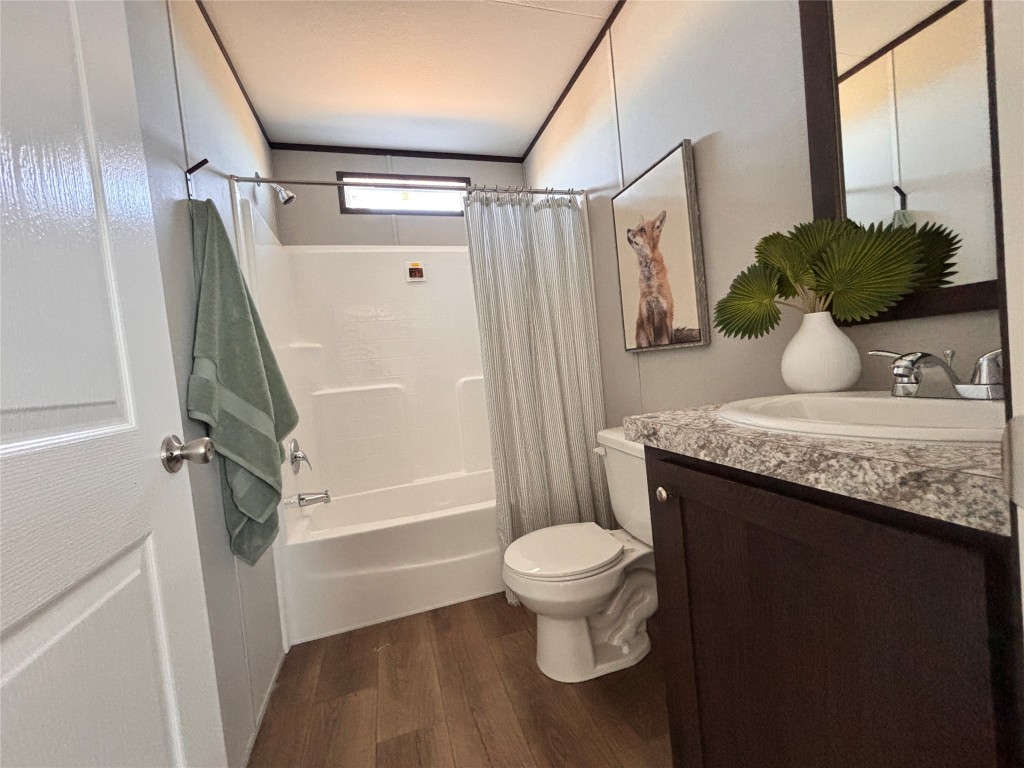 149 Castellana Way Elgin, TX 78621 - Photo 9 of 18 a bathroom with a sink a toilet and shower