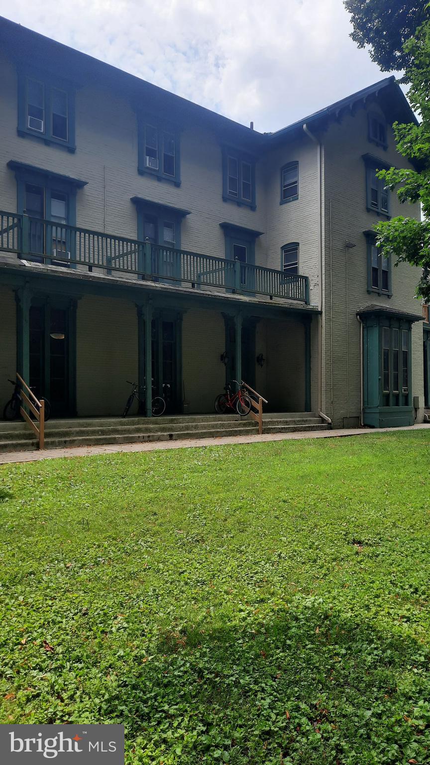 12 South Filbert Street, Unit A13 Mechanicsburg, PA 17055 - Photo 2 of 9 a front view of a house with a yard
