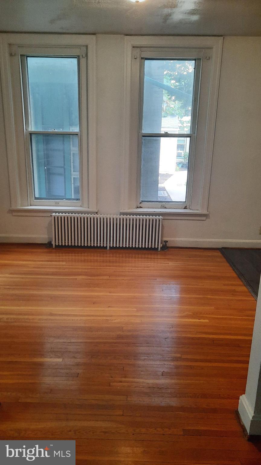 12 South Filbert Street, Unit A13 Mechanicsburg, PA 17055 - Photo 5 of 9 a view of a room with wooden floor and window