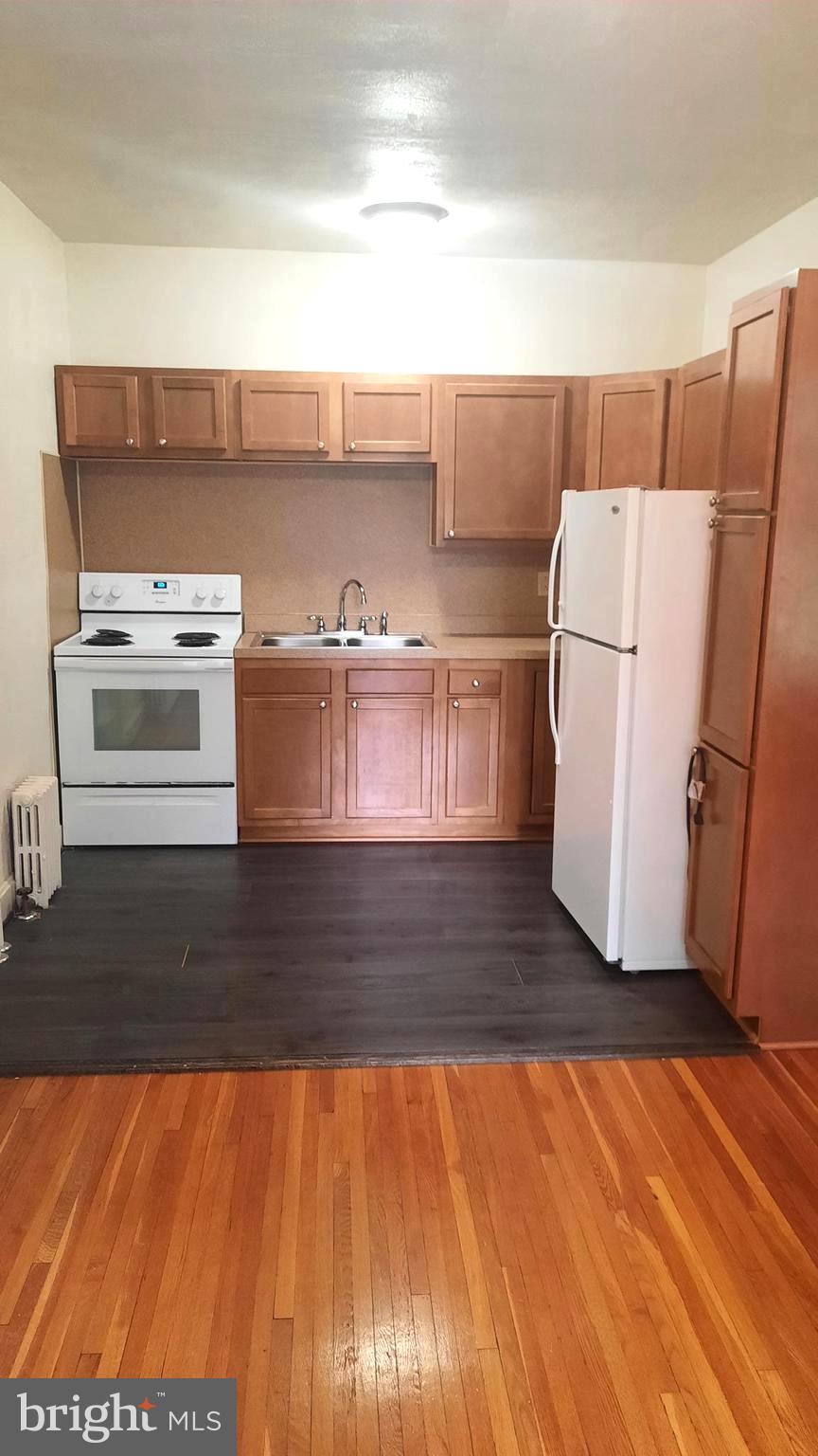 12 South Filbert Street, Unit A13 Mechanicsburg, PA 17055 - Photo 6 of 9 a view of kitchen and wooden floor