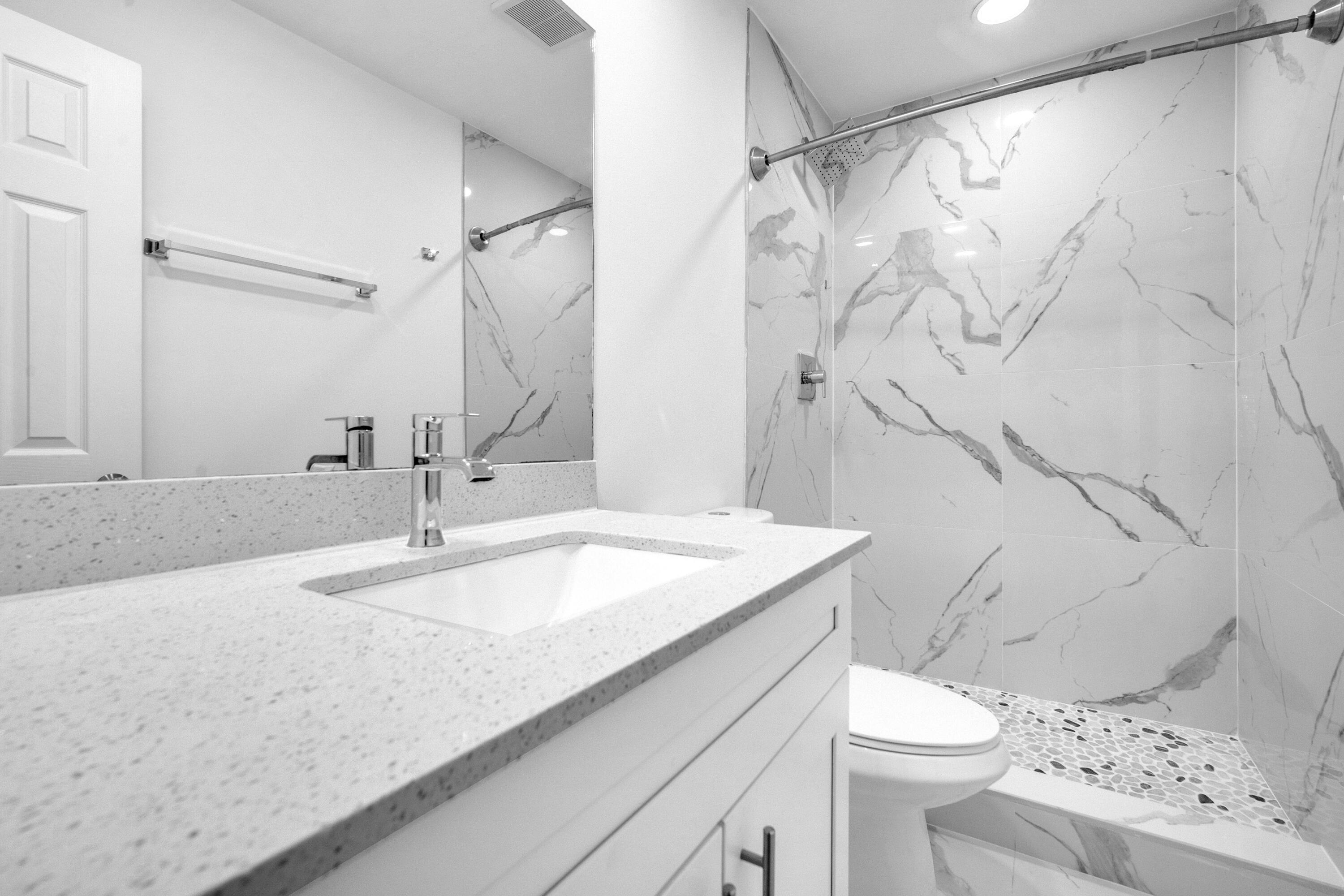 1015 Spanish River Road Boca Raton, FL 33432 - Photo 16 of 28 a bathroom with a sink toilet and shower