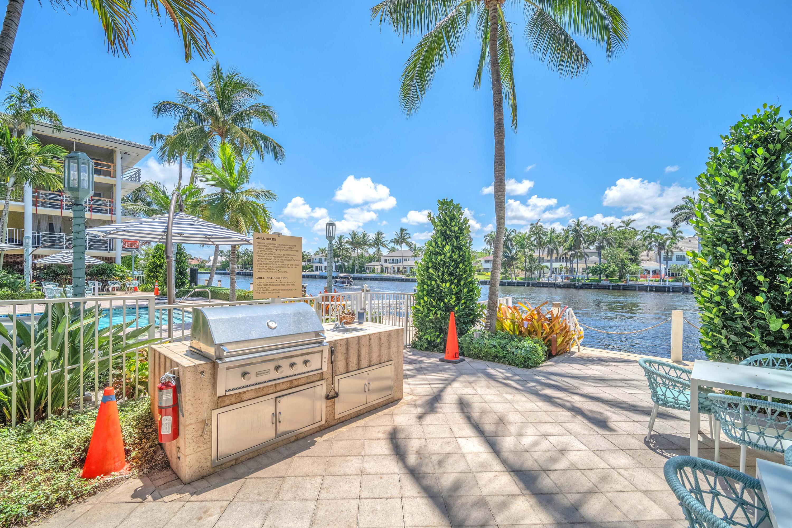 1015 Spanish River Road Boca Raton, FL 33432 - Photo 20 of 28 a view of a chairs and table in the patio