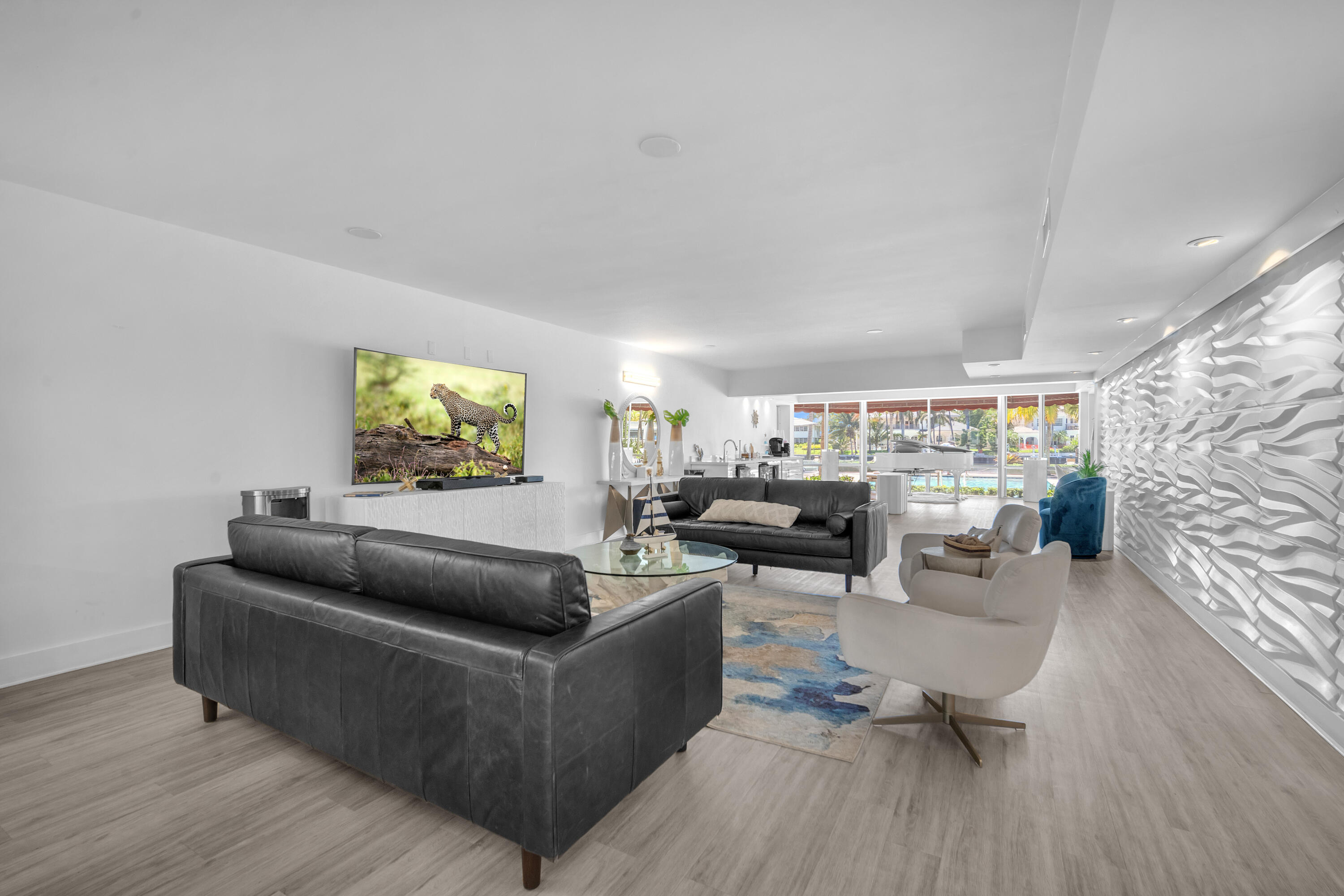 1015 Spanish River Road Boca Raton, FL 33432 - Photo 22 of 28 a living room with furniture and a wooden floor