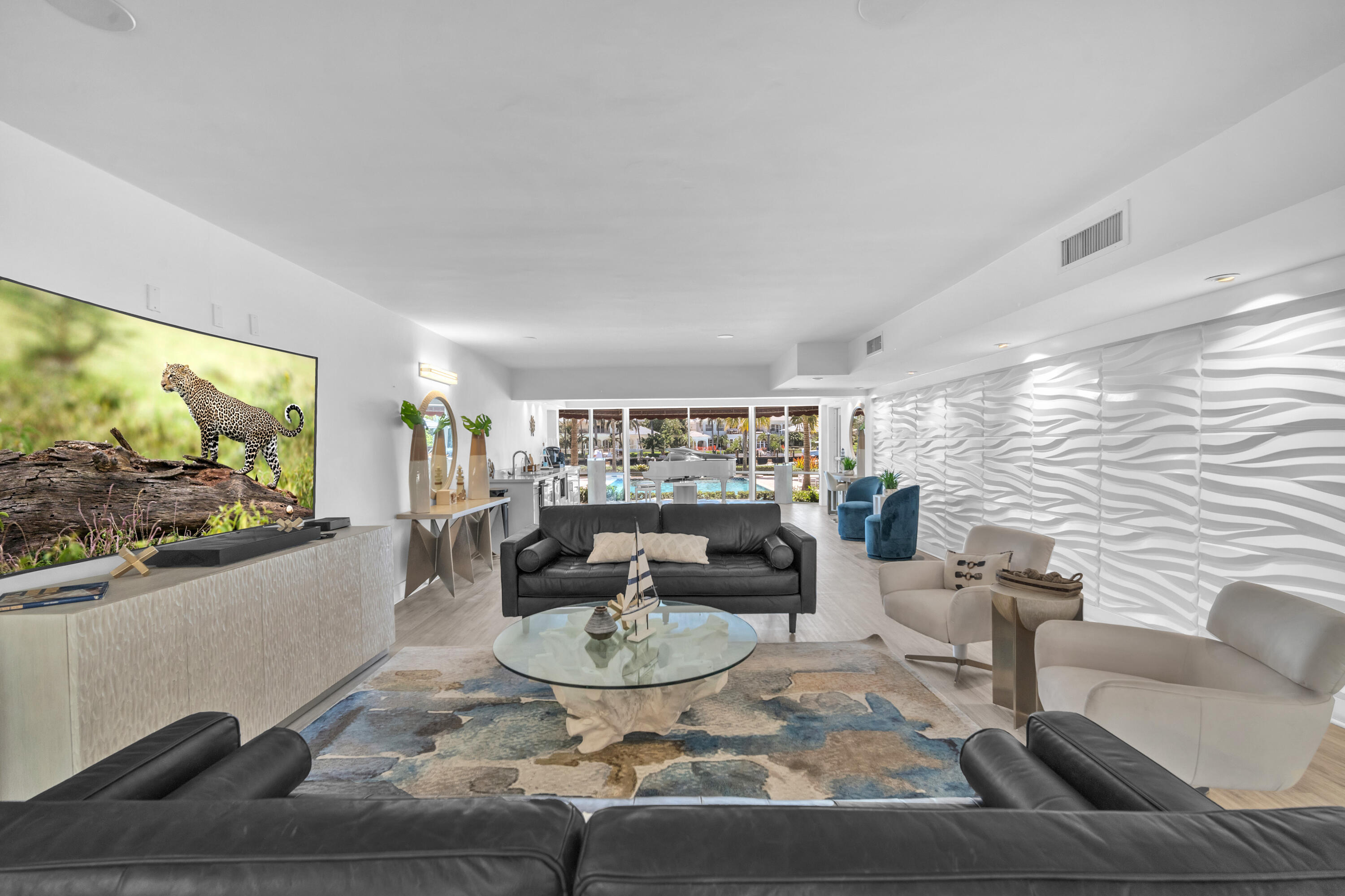 1015 Spanish River Road Boca Raton, FL 33432 - Photo 23 of 28 a living room with fireplace furniture and a flat screen tv