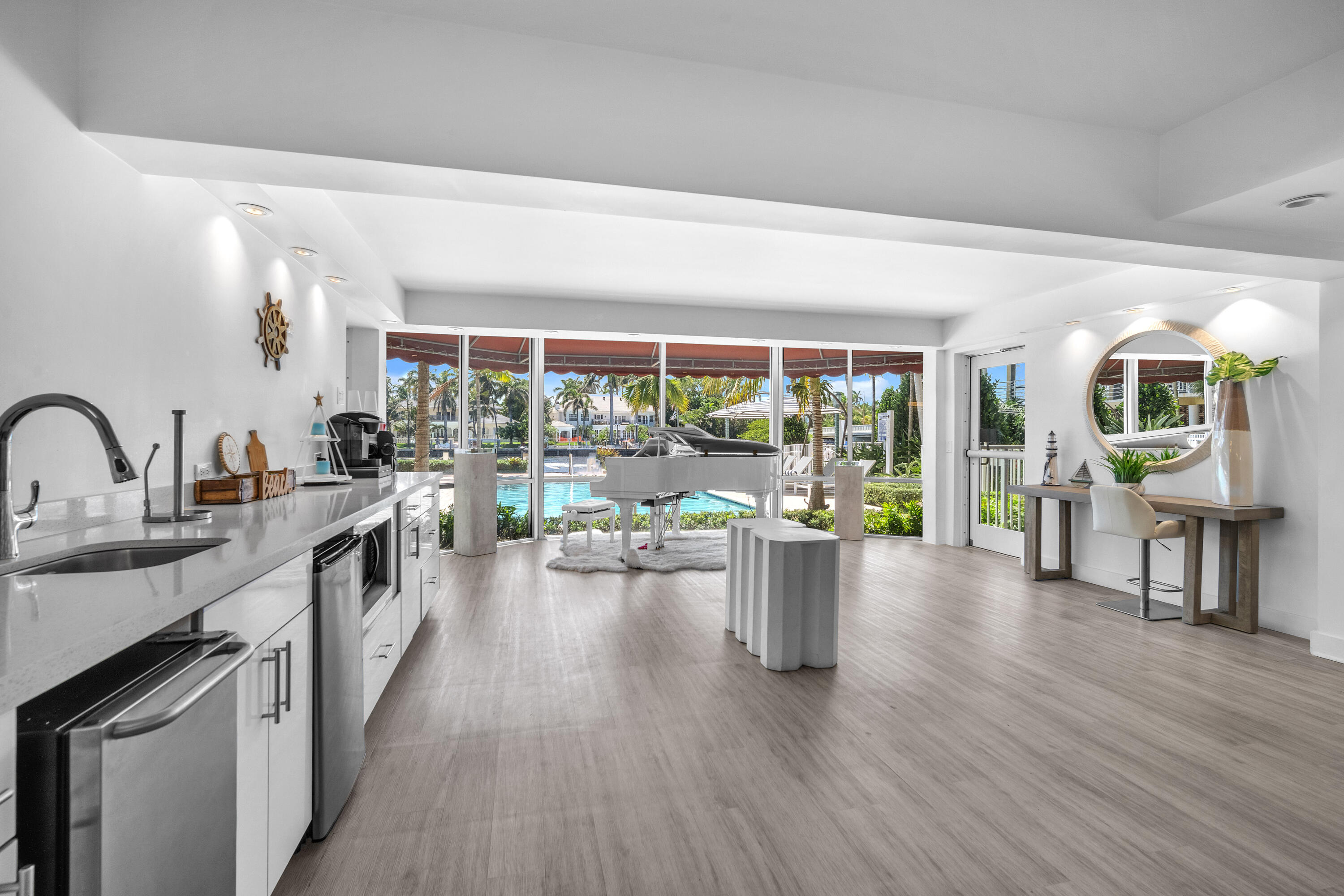 1015 Spanish River Road Boca Raton, FL 33432 - Photo 25 of 28 a view of a living room and kitchen with a large window