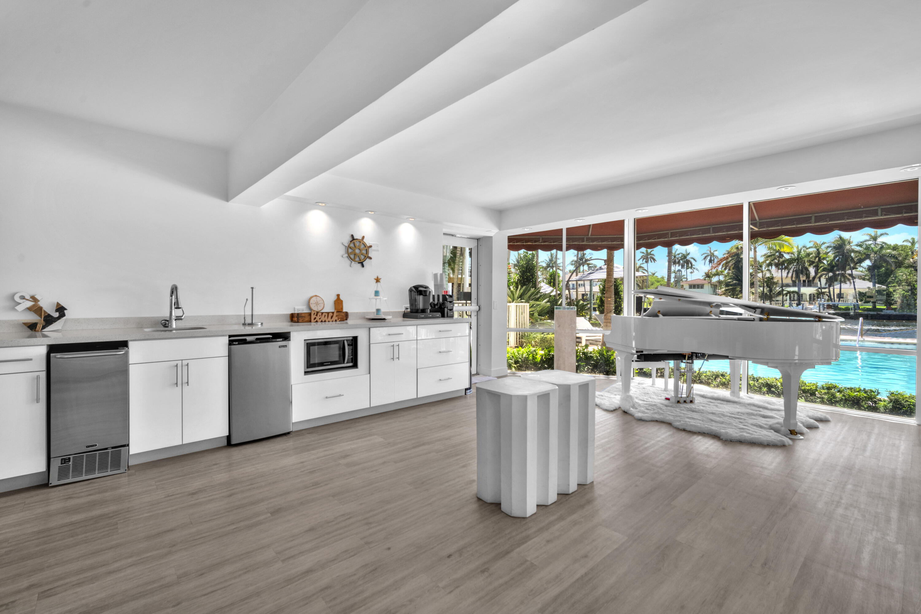1015 Spanish River Road Boca Raton, FL 33432 - Photo 27 of 28 a kitchen with a sink cabinets and wooden floor