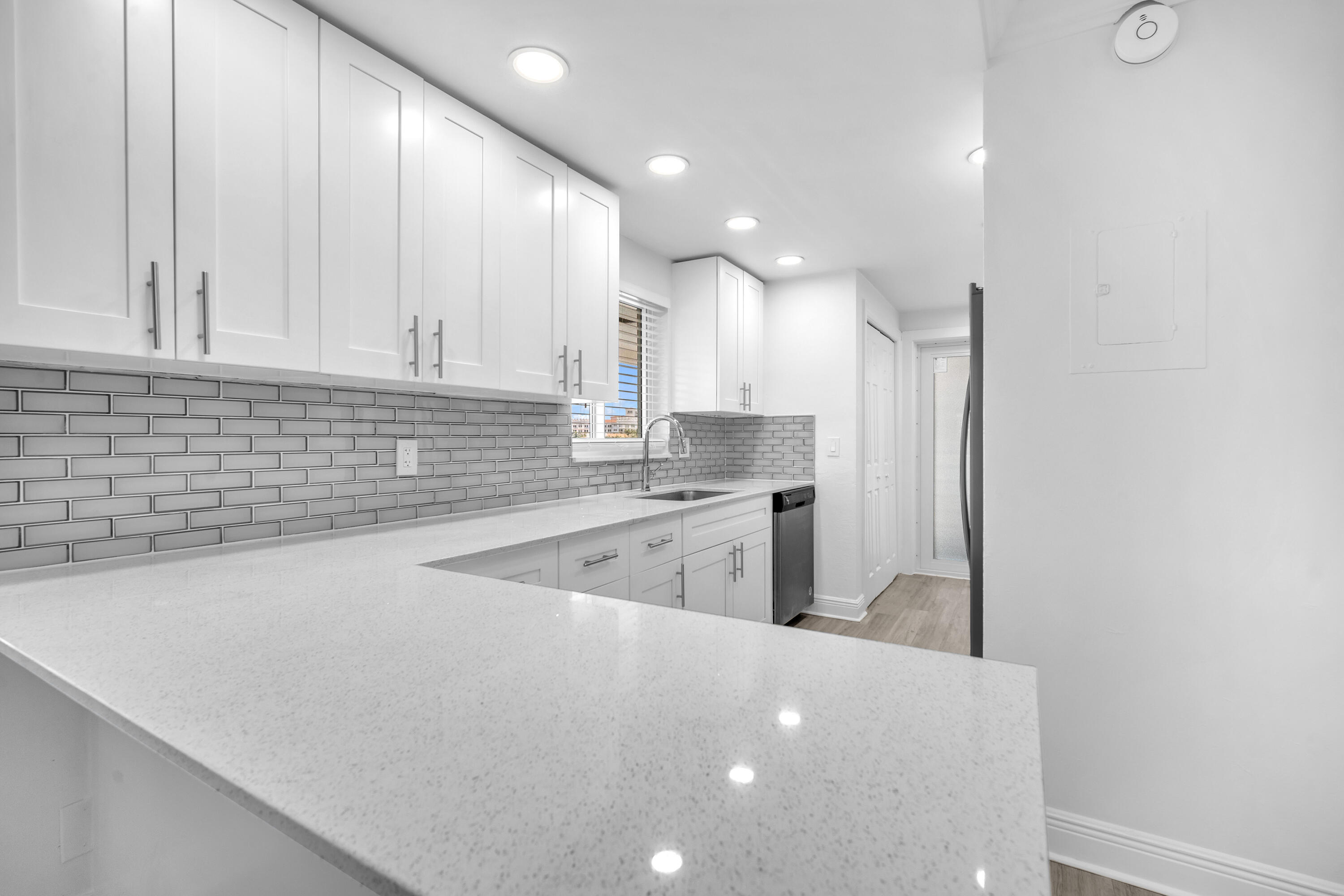 1015 Spanish River Road Boca Raton, FL 33432 - Photo 7 of 28 a kitchen with stainless steel appliances a sink a refrigerator and a stove