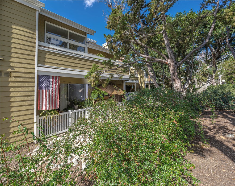 3730 South Bear Street, Unit E Santa Ana, CA 92704 - Photo 1 of 43 front view of a house with a tree