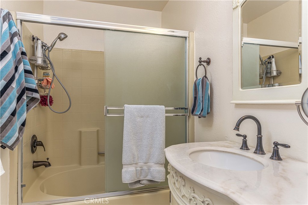 3730 South Bear Street, Unit E Santa Ana, CA 92704 - Photo 12 of 43 a bathroom with a sink and a tub