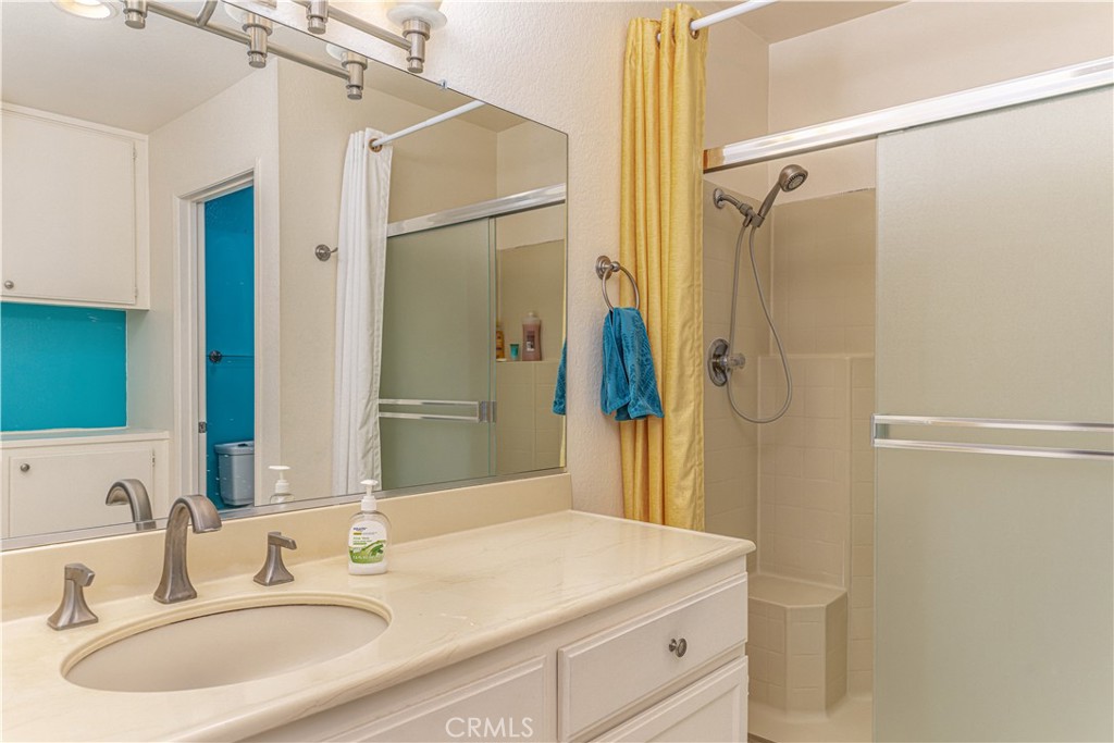 3730 South Bear Street, Unit E Santa Ana, CA 92704 - Photo 16 of 43 a bathroom with a sink and a mirror