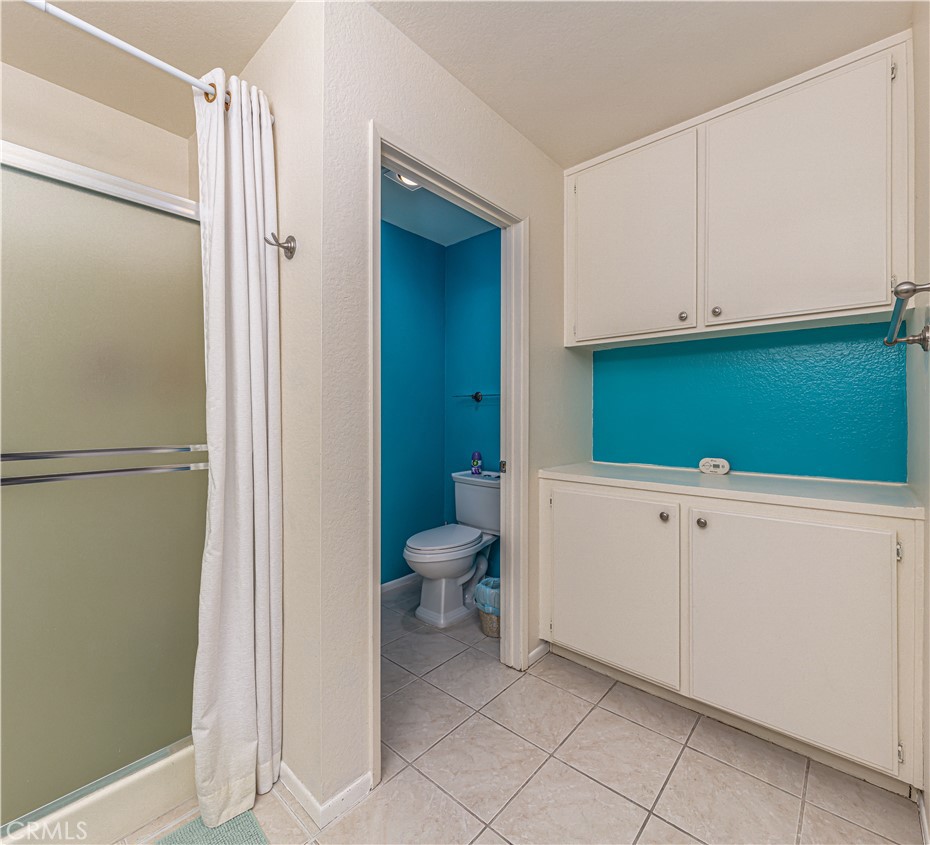 3730 South Bear Street, Unit E Santa Ana, CA 92704 - Photo 17 of 43 a bathroom with a toilet