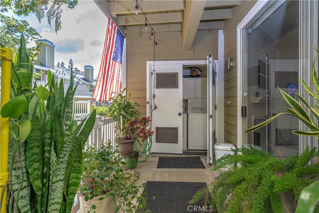 3730 South Bear Street, Unit E Santa Ana, CA 92704 - Photo 19 of 43 a front view of a house with a yard