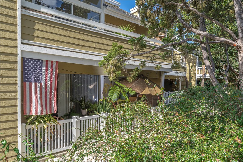 3730 South Bear Street, Unit E Santa Ana, CA 92704 - Photo 2 of 43 a front view of a house with a porch