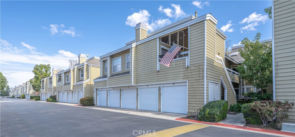3730 South Bear Street, Unit E Santa Ana, CA 92704 - Photo 22 of 43 a view of a house with a yard