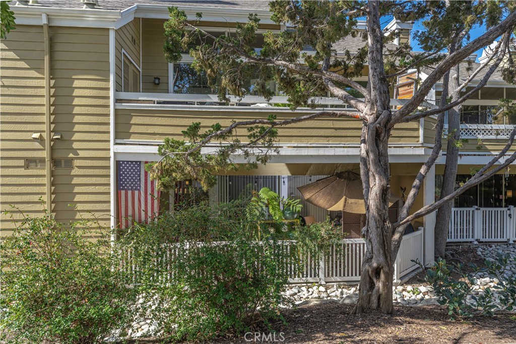 3730 South Bear Street, Unit E Santa Ana, CA 92704 - Photo 3 of 43 a view of a house with a tree