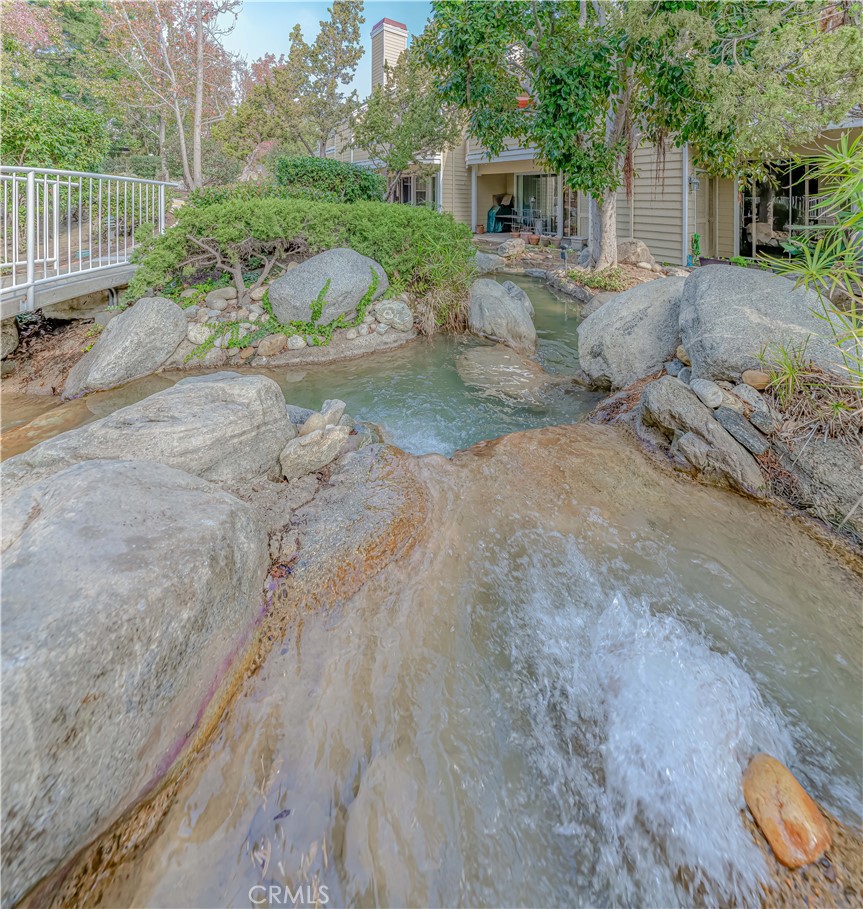 3730 South Bear Street, Unit E Santa Ana, CA 92704 - Photo 38 of 43 a view of a house with a yard