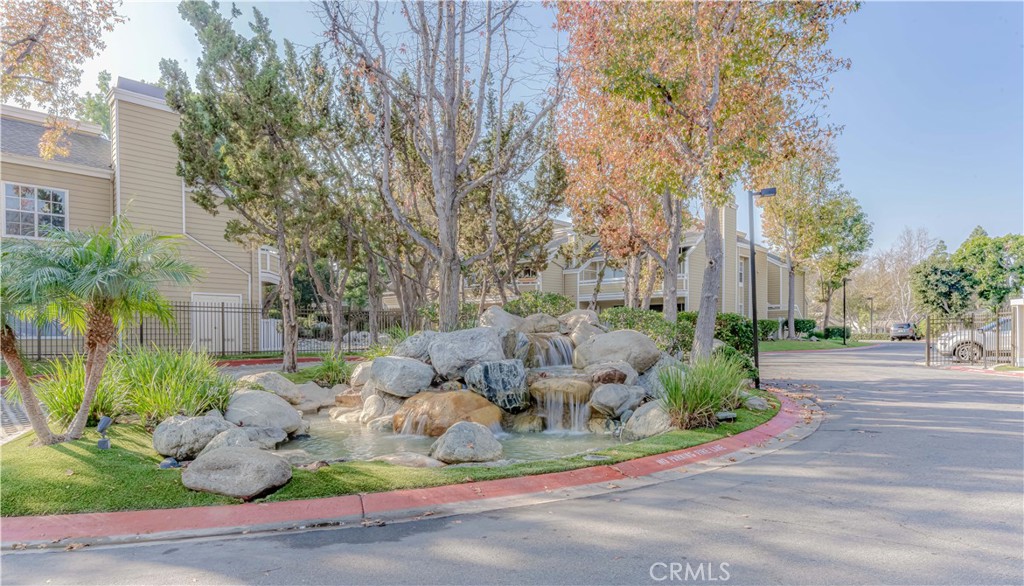 3730 South Bear Street, Unit E Santa Ana, CA 92704 - Photo 39 of 43 a view of a yard with plants and trees