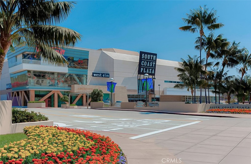3730 South Bear Street, Unit E Santa Ana, CA 92704 - Photo 40 of 43 a view of multiple houses with a patio and a fountain