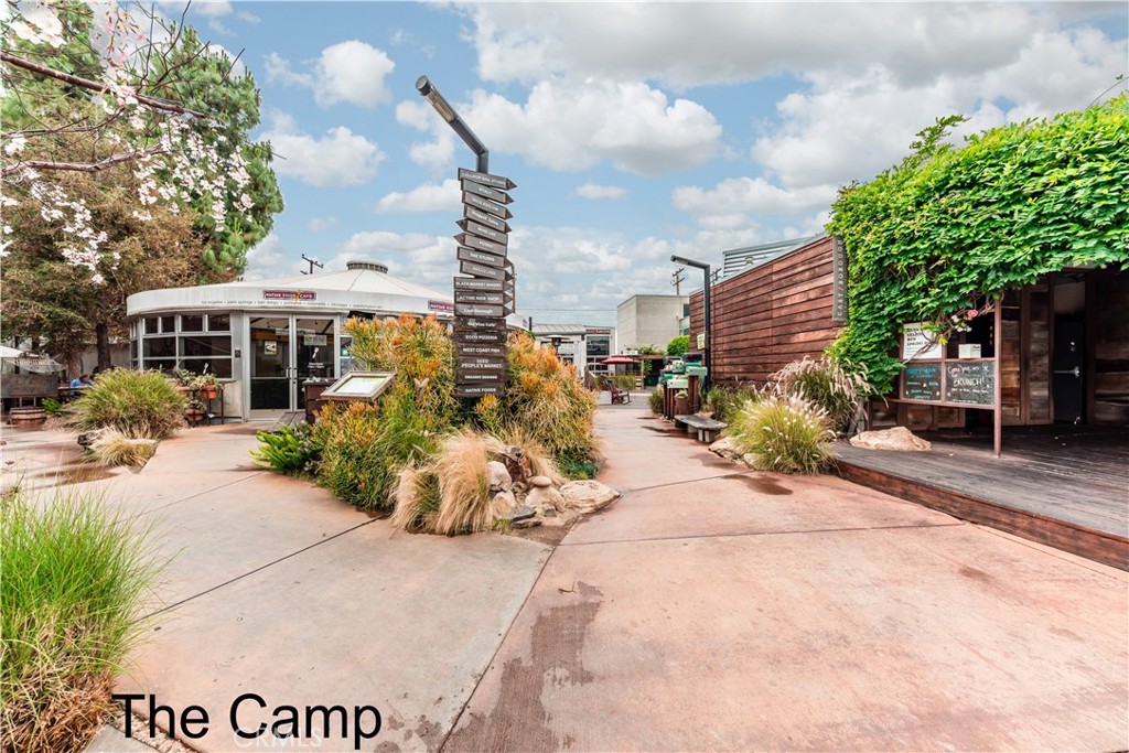 3730 South Bear Street, Unit E Santa Ana, CA 92704 - Photo 43 of 43 a front view of a house with garden