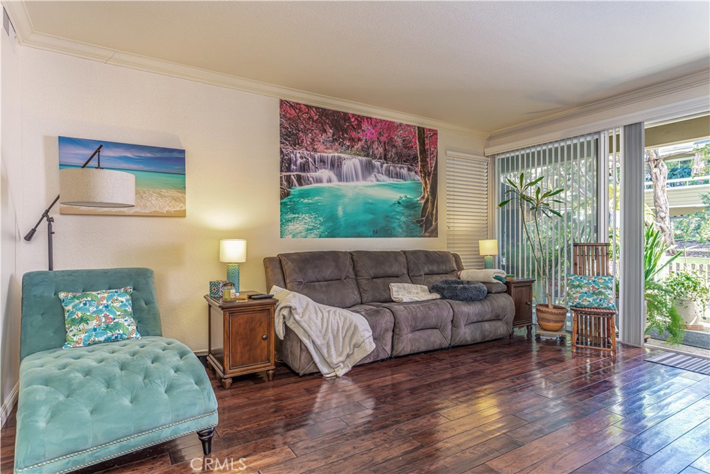 3730 South Bear Street, Unit E Santa Ana, CA 92704 - Photo 5 of 43 a living room with furniture and a large window
