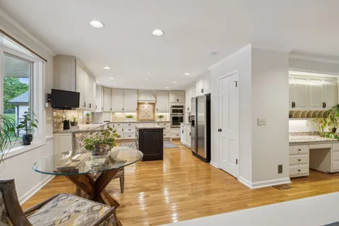a kitchen with stainless steel appliances granite countertop a sink and cabinets