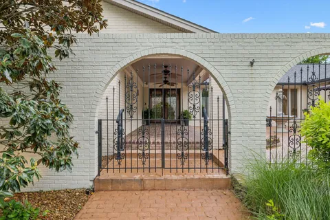 a view of entrance gate of a house