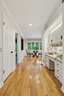 a kitchen with granite countertop a refrigerator and a sink