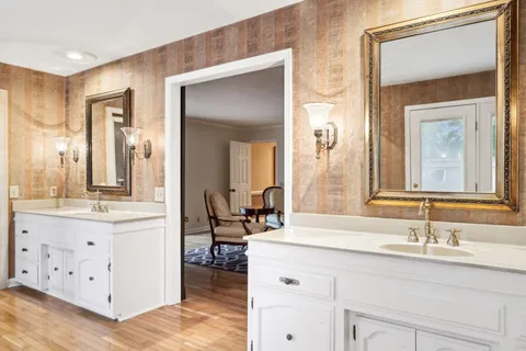 a view of a park and trees in the background