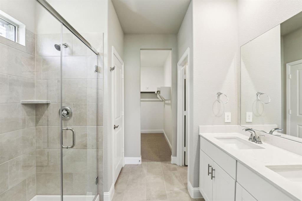 1636 Arches Road Anna, TX 75409 - Photo 13 of 22 a bathroom with a double vanity sink mirror and shower