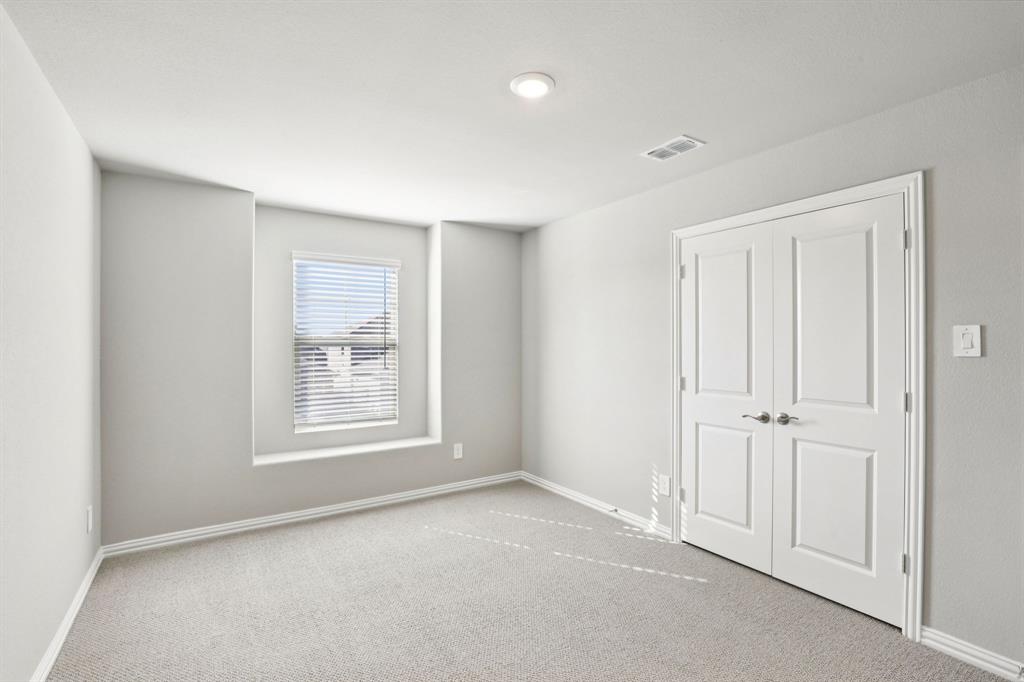 1636 Arches Road Anna, TX 75409 - Photo 21 of 22 an empty room with windows