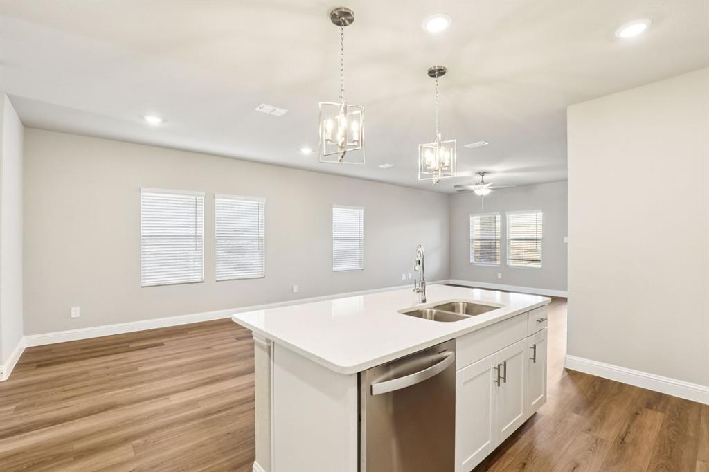 1636 Arches Road Anna, TX 75409 - Photo 3 of 22 a bathroom with a sink a vanity and a large mirror