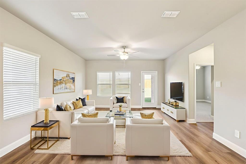 1636 Arches Road Anna, TX 75409 - Photo 9 of 22 a living room with fireplace furniture and a flat screen tv