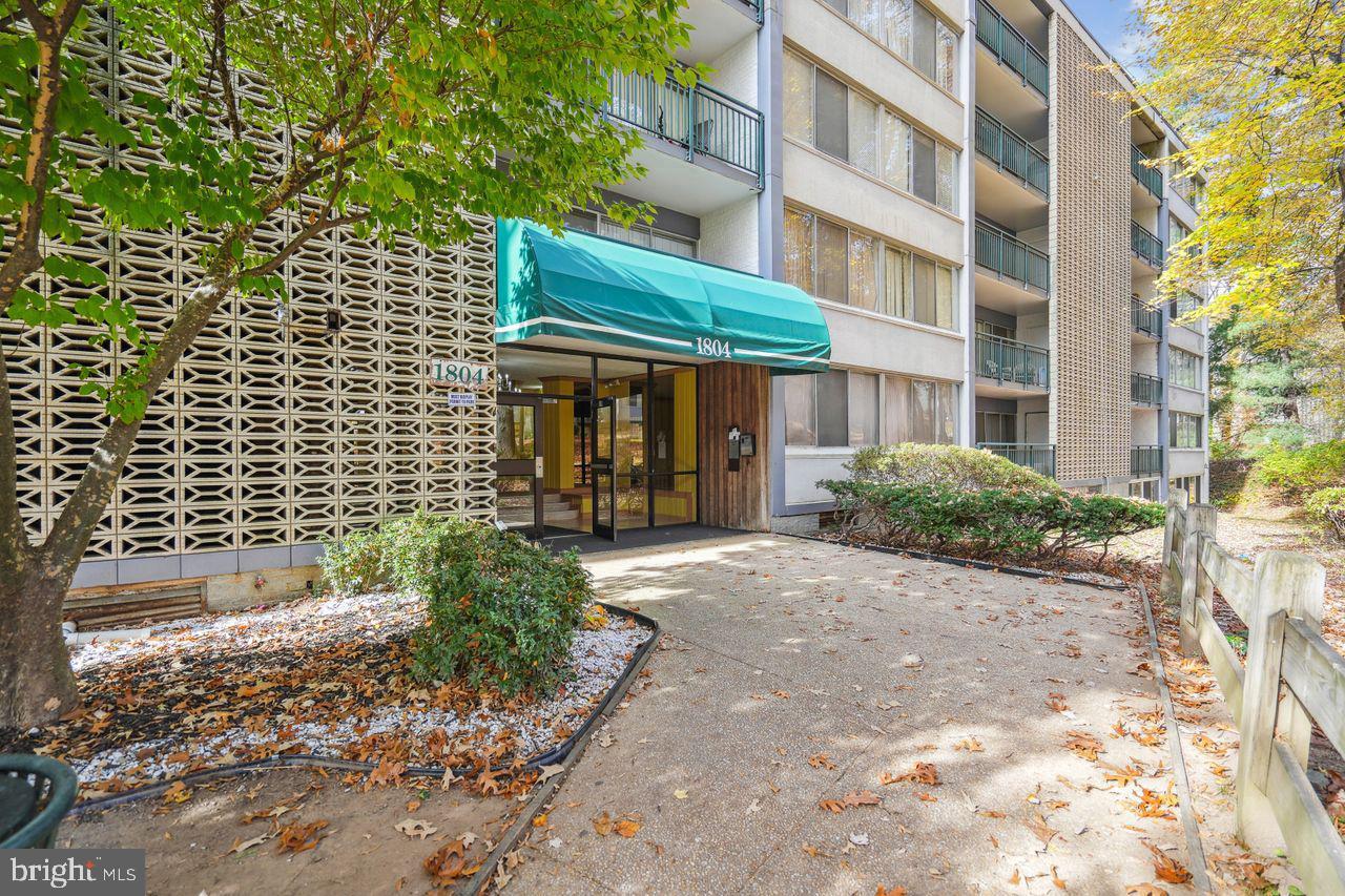 1804 Metzerott Road, Unit 303 Hyattsville, MD 20783 - Photo 11 of 13 a view of a building with a yard