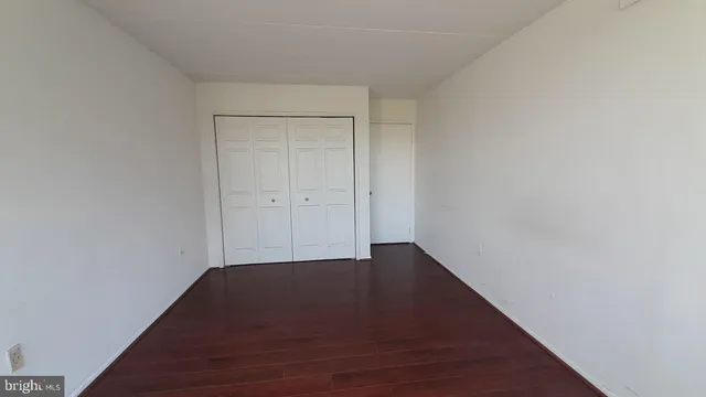 a view of room with wooden floor