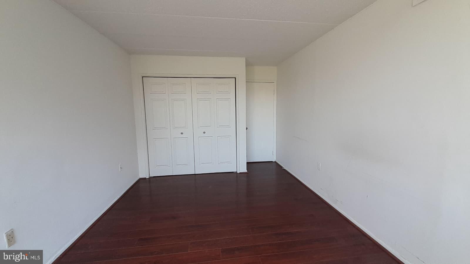 1804 Metzerott Road, Unit 303 Hyattsville, MD 20783 - Photo 8 of 13 a view of room with wooden floor