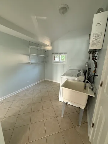 a room with a couch and cabinets