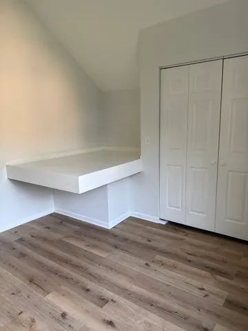 a view of room with hardwood floor