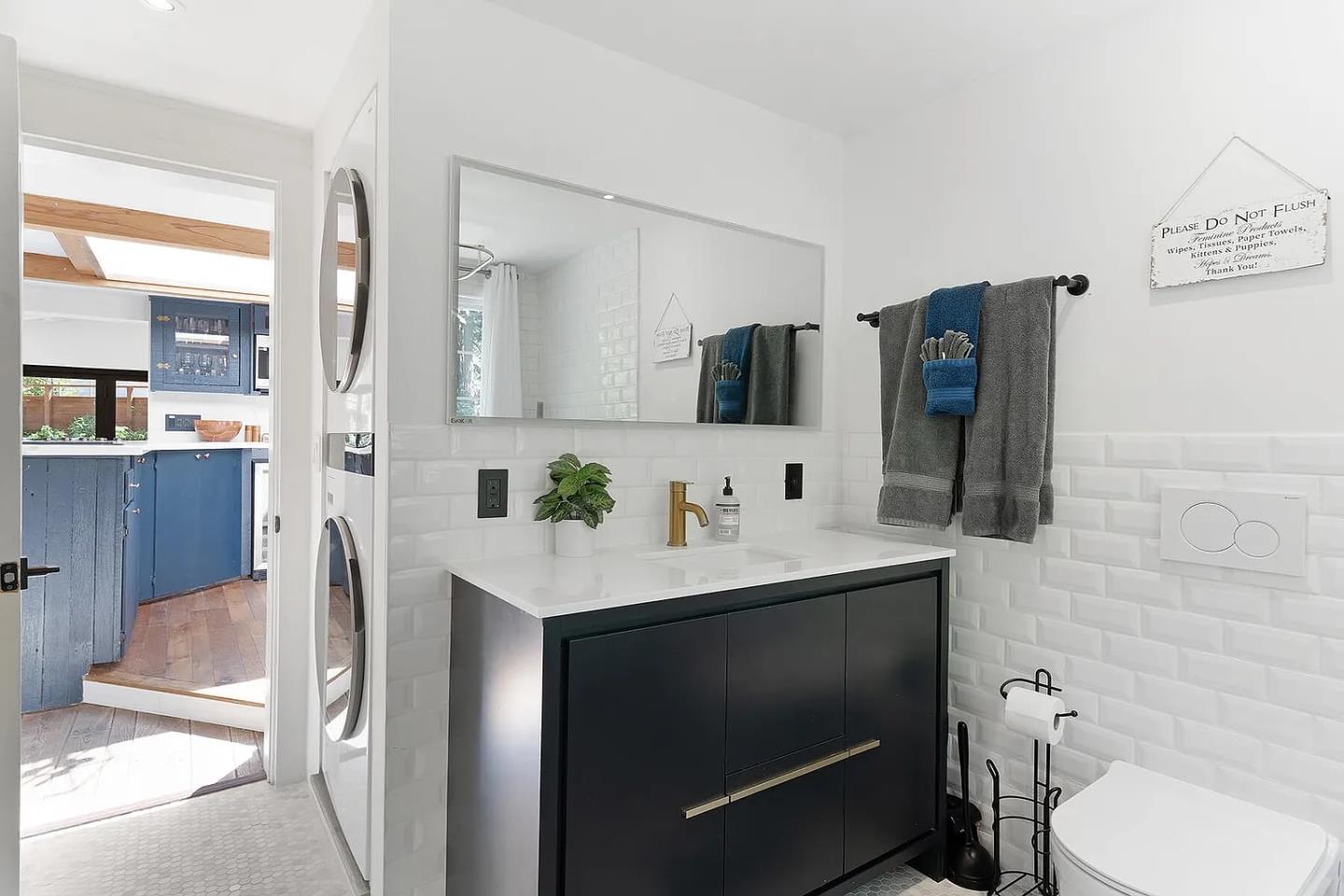 1003 Laurel Glen Road Soquel, CA 95073 - Photo 34 of 101 a bathroom with a toilet sink and mirror