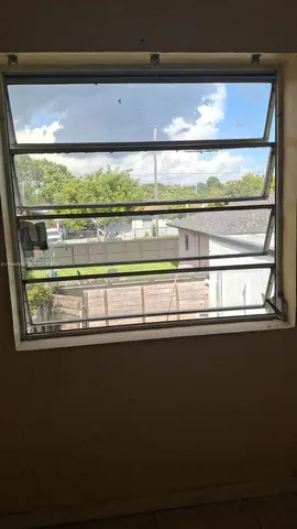 a view of a sink with a large window