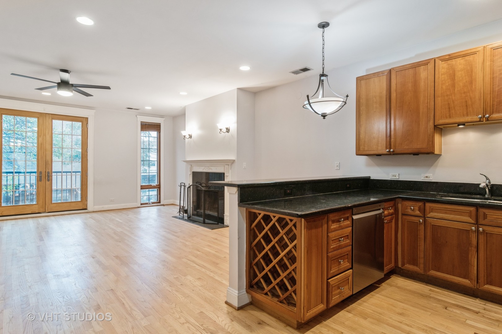 1939 West Division Street, Unit R2 Chicago, IL 60622 - Photo 6 of 18 a kitchen with stainless steel appliances granite countertop a stove a sink and a refrigerator