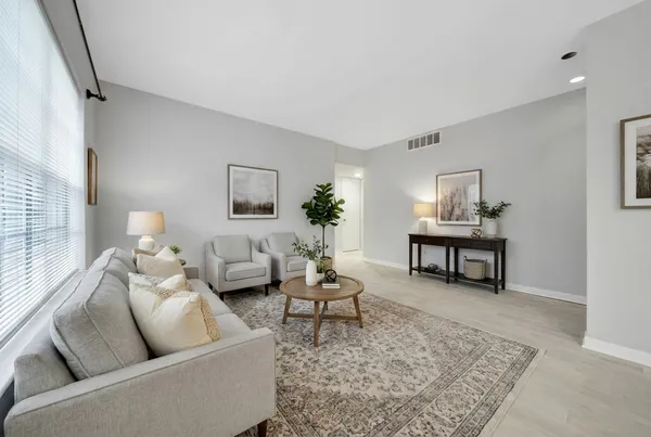 a living room with furniture and a couch