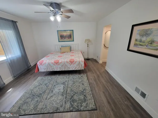 a bedroom with bed and a window