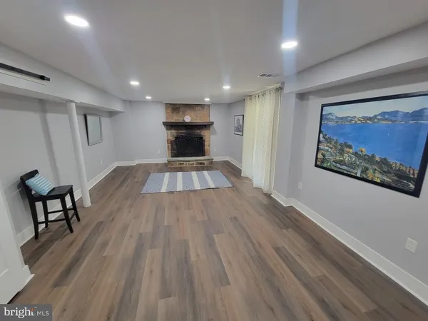 a view of kitchen with furniture and wooden floor